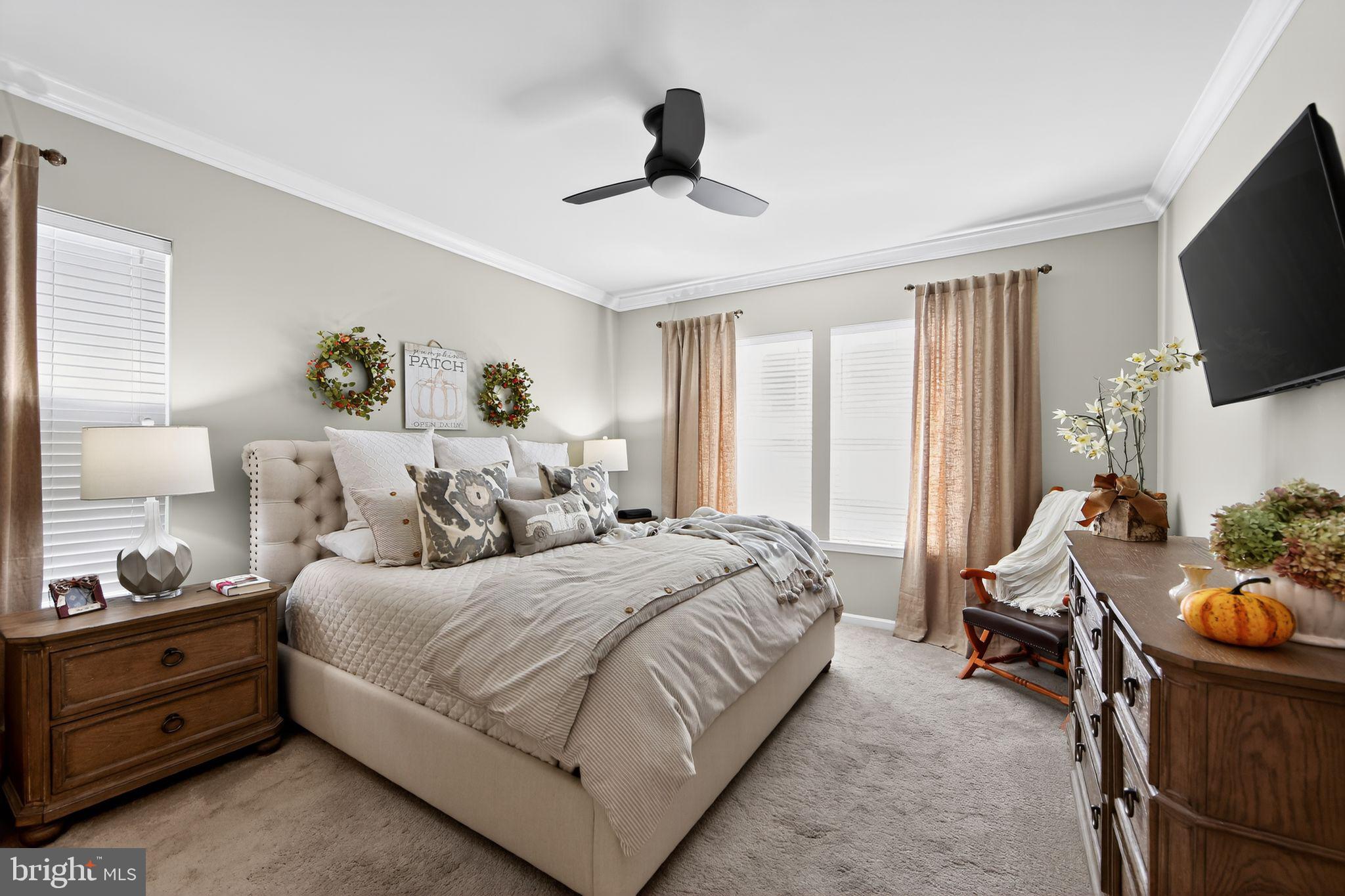618 Kent Court Chester Springs, PA 19425 - Photo 15 of 34 a spacious bedroom with a bed and a flat screen tv
