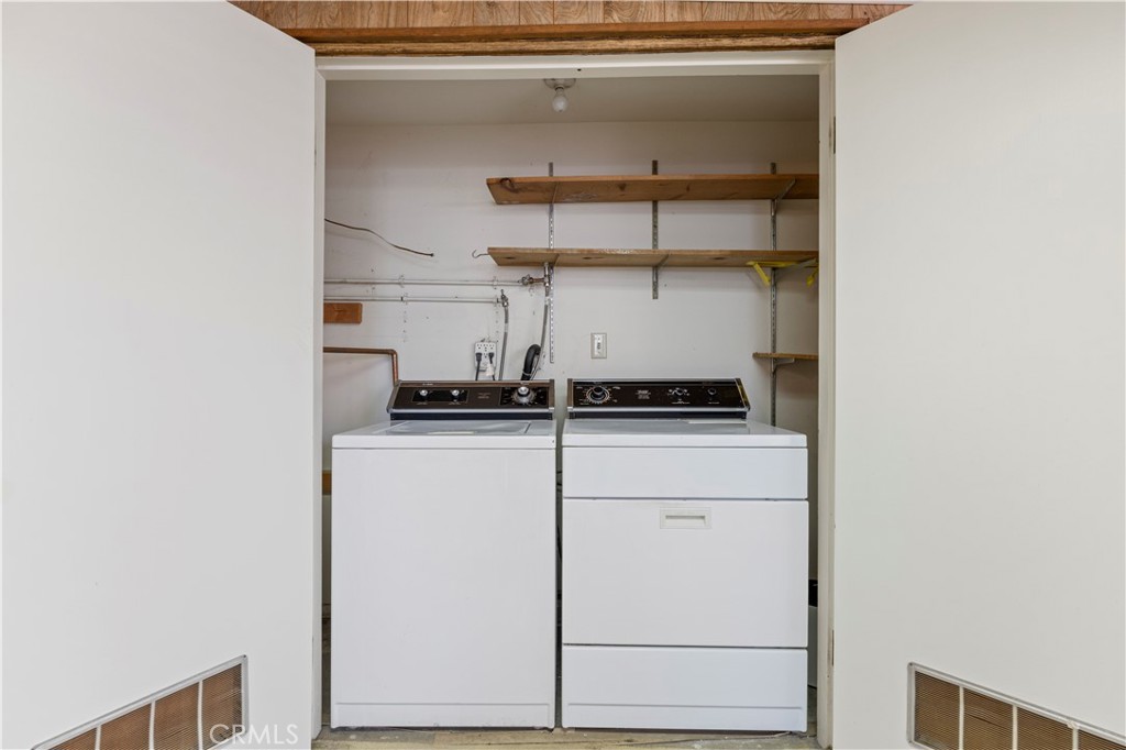 26838 C Ave Of The Oaks, Unit C Newhall, CA 91321 - Photo 12 of 34 a kitchen with a refrigerator and cabinets