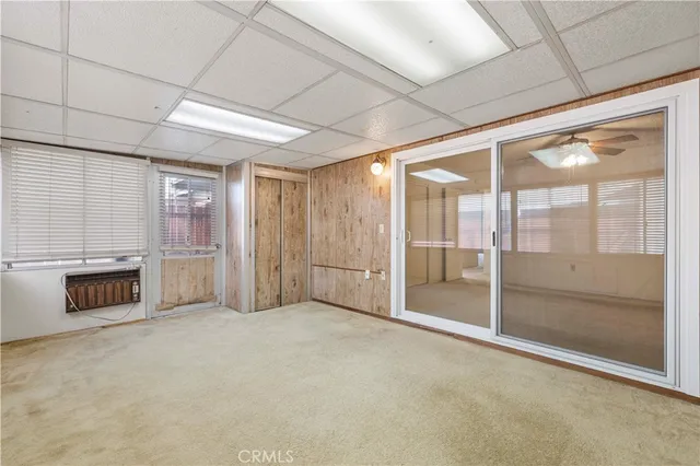 a view of an empty room with a fireplace