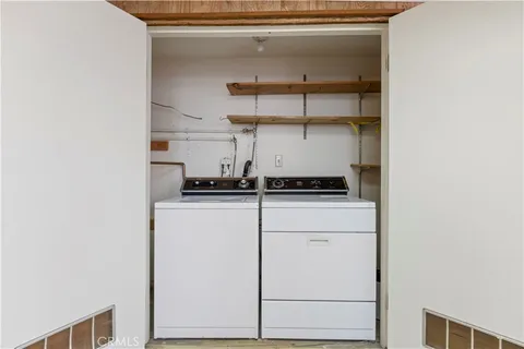 a kitchen with a refrigerator and cabinets