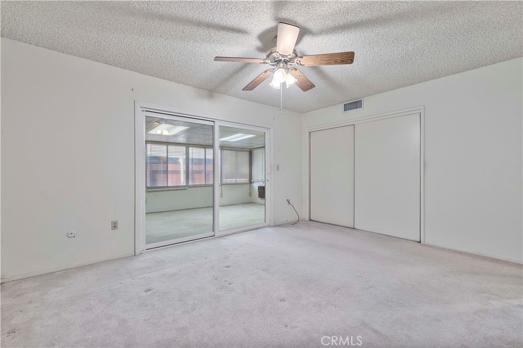 26838 C Ave Of The Oaks, Unit C Newhall, CA 91321 - Photo 19 of 34 an empty room with closet and windows