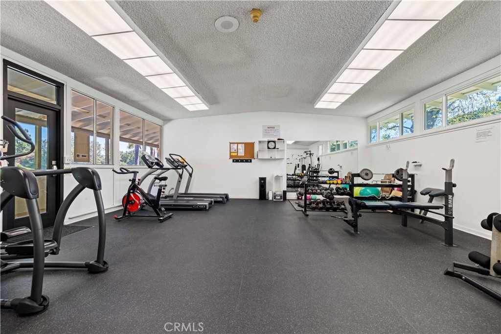 26838 C Ave Of The Oaks, Unit C Newhall, CA 91321 - Photo 29 of 34 a view of a room with gym equipment