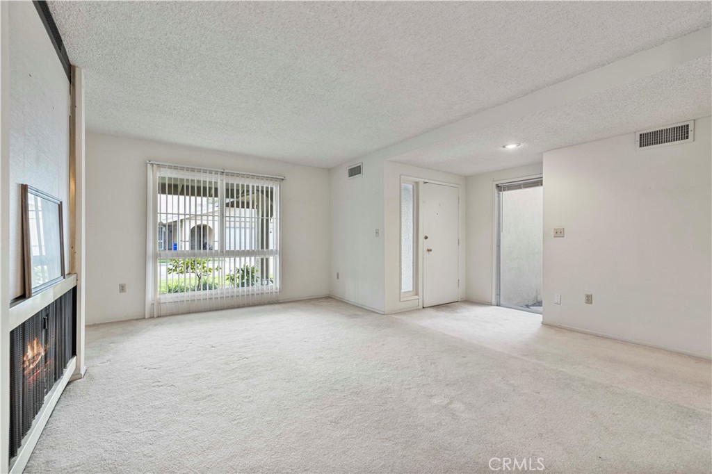 26838 C Ave Of The Oaks, Unit C Newhall, CA 91321 - Photo 3 of 34 an empty room with windows and closet