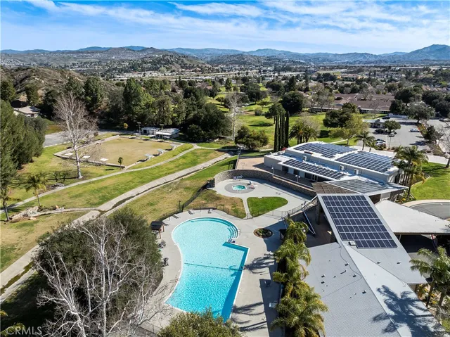 an aerial view of a house with a swimming pool