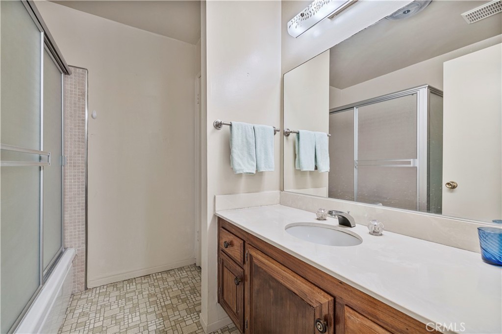 26838 C Ave Of The Oaks, Unit C Newhall, CA 91321 - Photo 10 of 34 a bathroom with a sink and a mirror