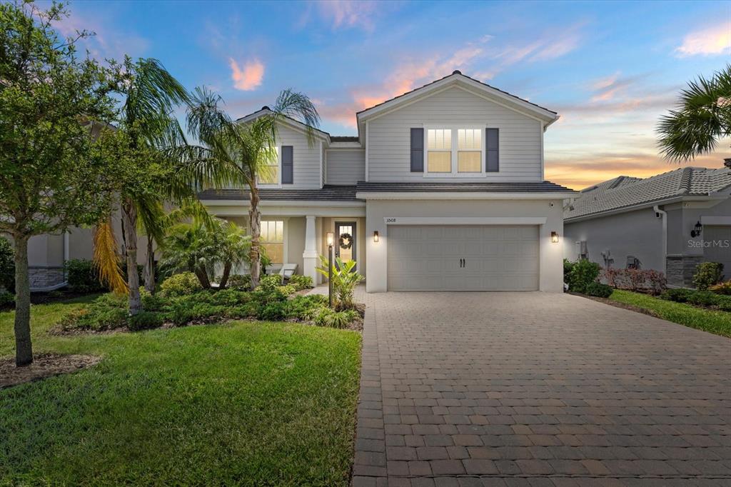 3508 Anchor Bay Trail Lakewood Ranch, FL 34211 - Photo 1 of 74 a front view of a house with a yard and garage