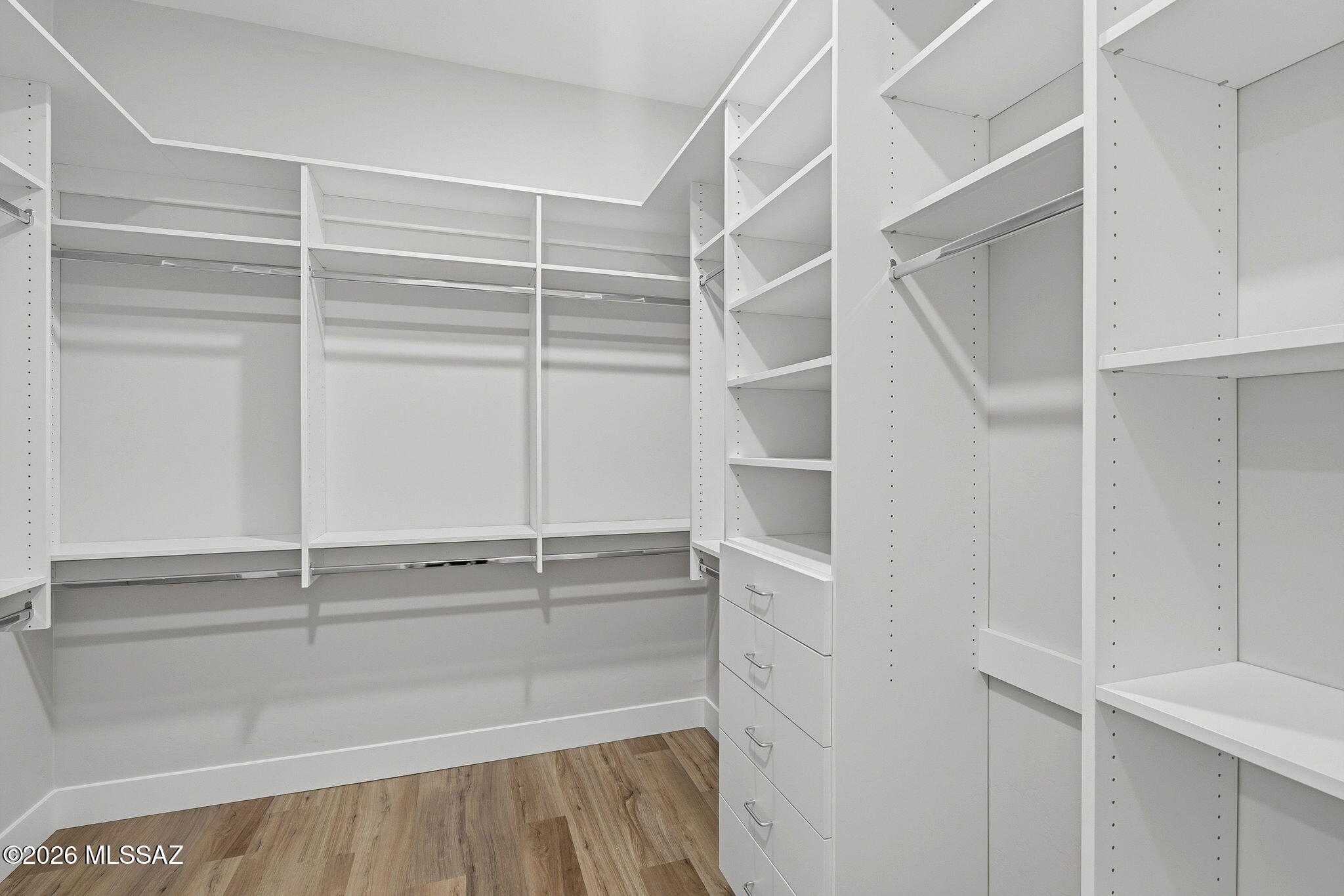 2020 East River Road, Unit 201 Tucson, AZ 85718 - Photo 7 of 10 a view of walk in closet with empty racks