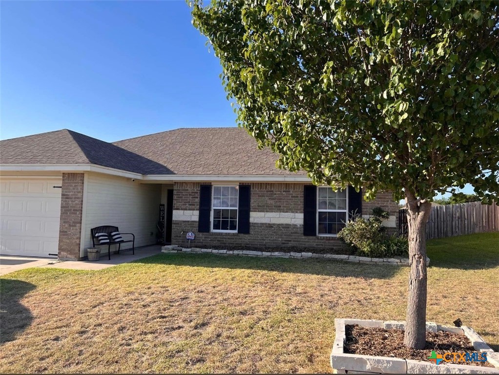 404 Blayton Street Troy, TX 76579 - Photo 1 of 30 a front view of a house with a yard
