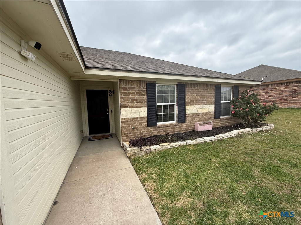 404 Blayton Street Troy, TX 76579 - Photo 2 of 30 a front view of a house with a yard