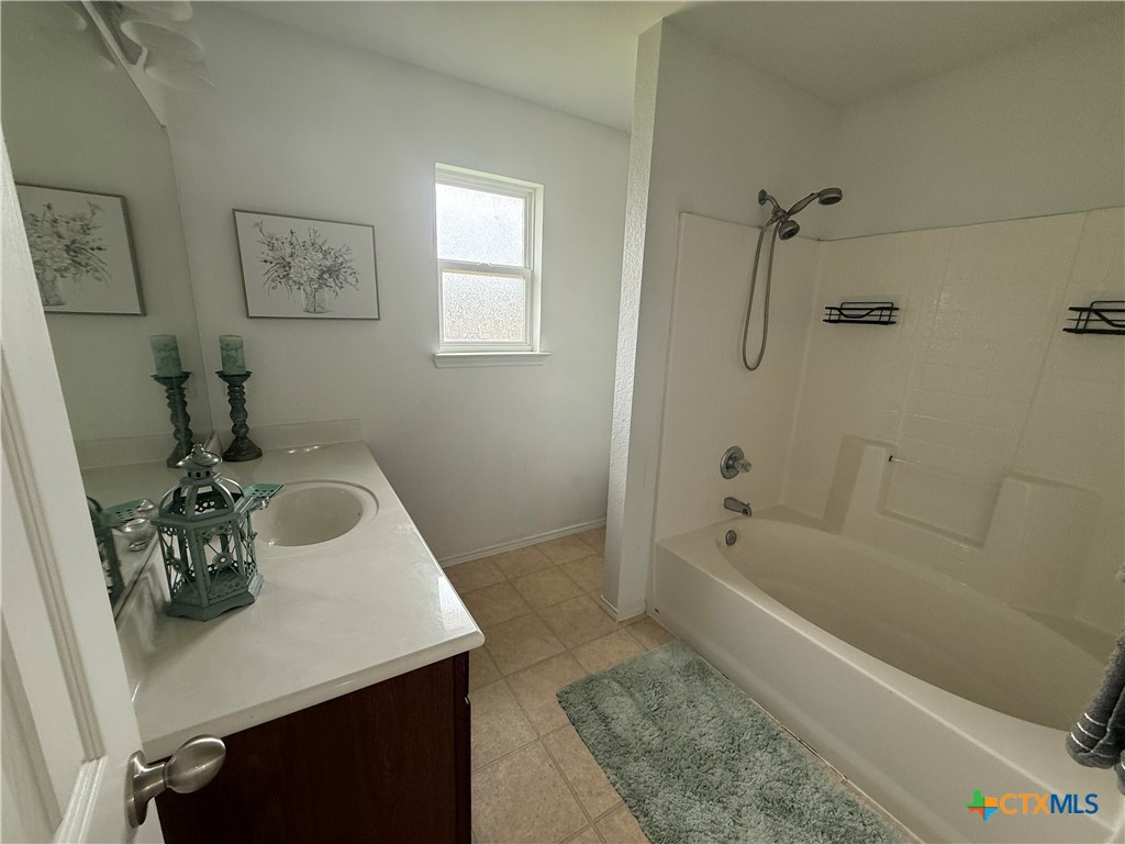 404 Blayton Street Troy, TX 76579 - Photo 21 of 30 a bathroom with a sink a bathtub and a shower