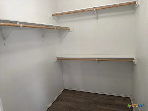 a view of an empty walk in closet