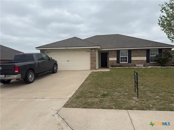 a house view with a garden space