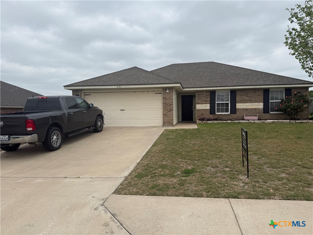 404 Blayton Street Troy, TX 76579 - Photo 3 of 30 a house view with a garden space