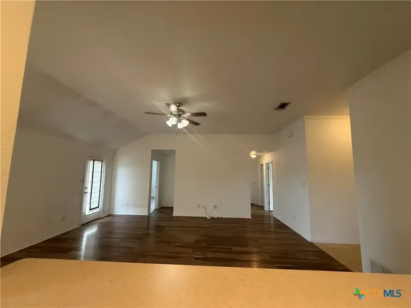 a living room with kitchen island