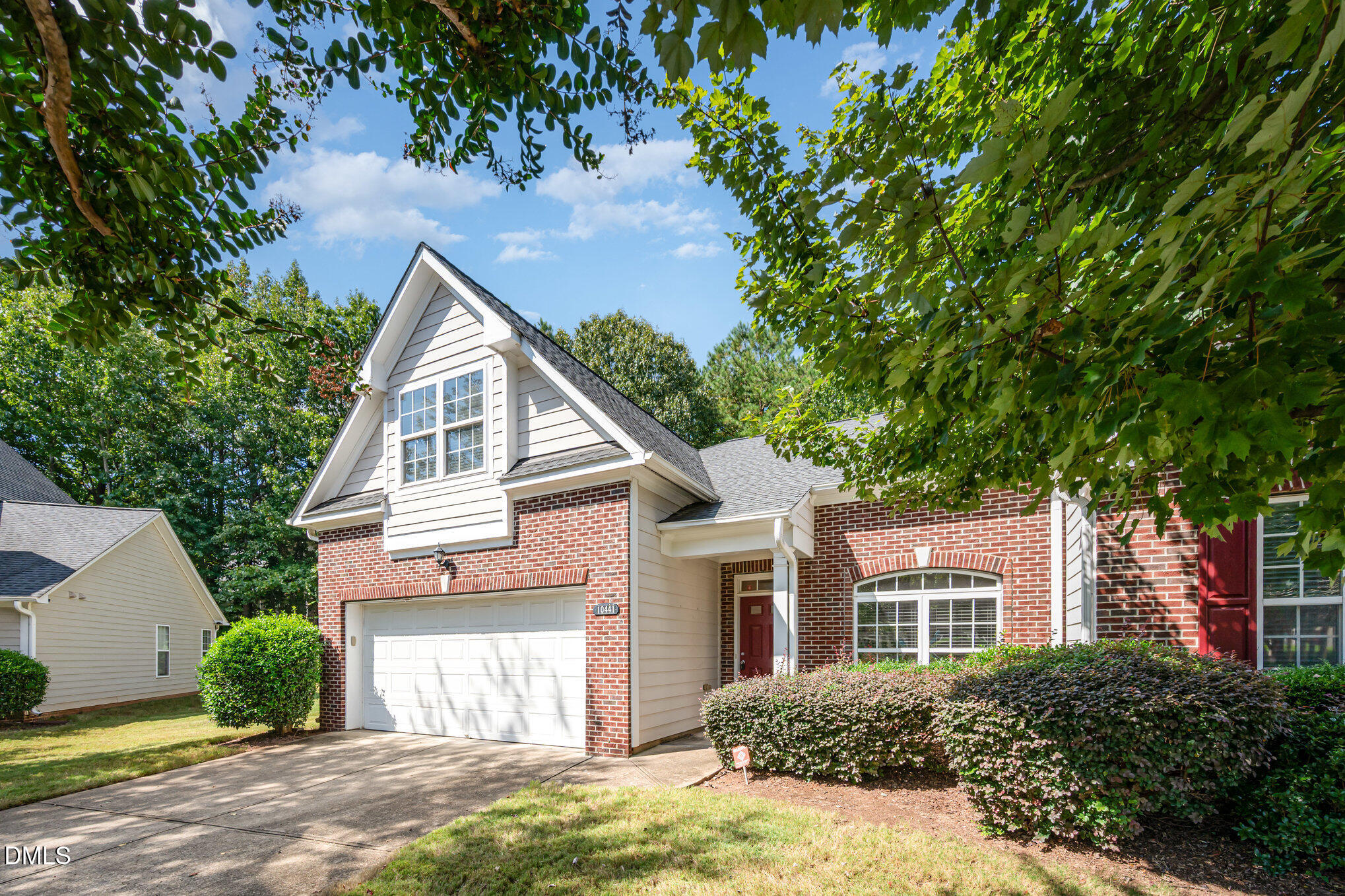 10441 Blue Dun Way Raleigh, NC 27614 - Photo 3 of 23 a view of a yard in front of a house with plants and large tree