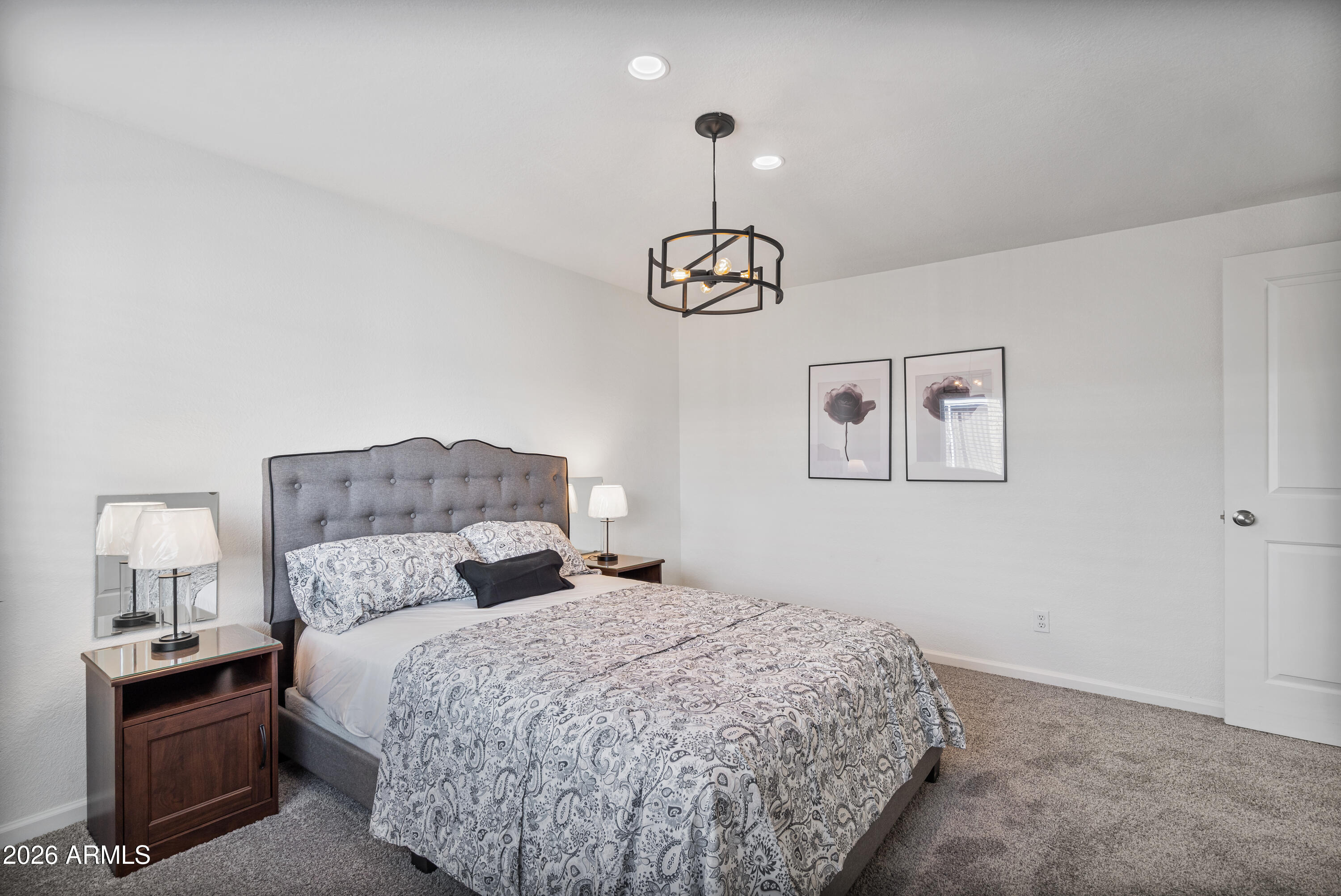205 South Higley Road, Unit 52 Mesa, AZ 85206 - Photo 22 of 34 a bedroom with a bed and wooden floor