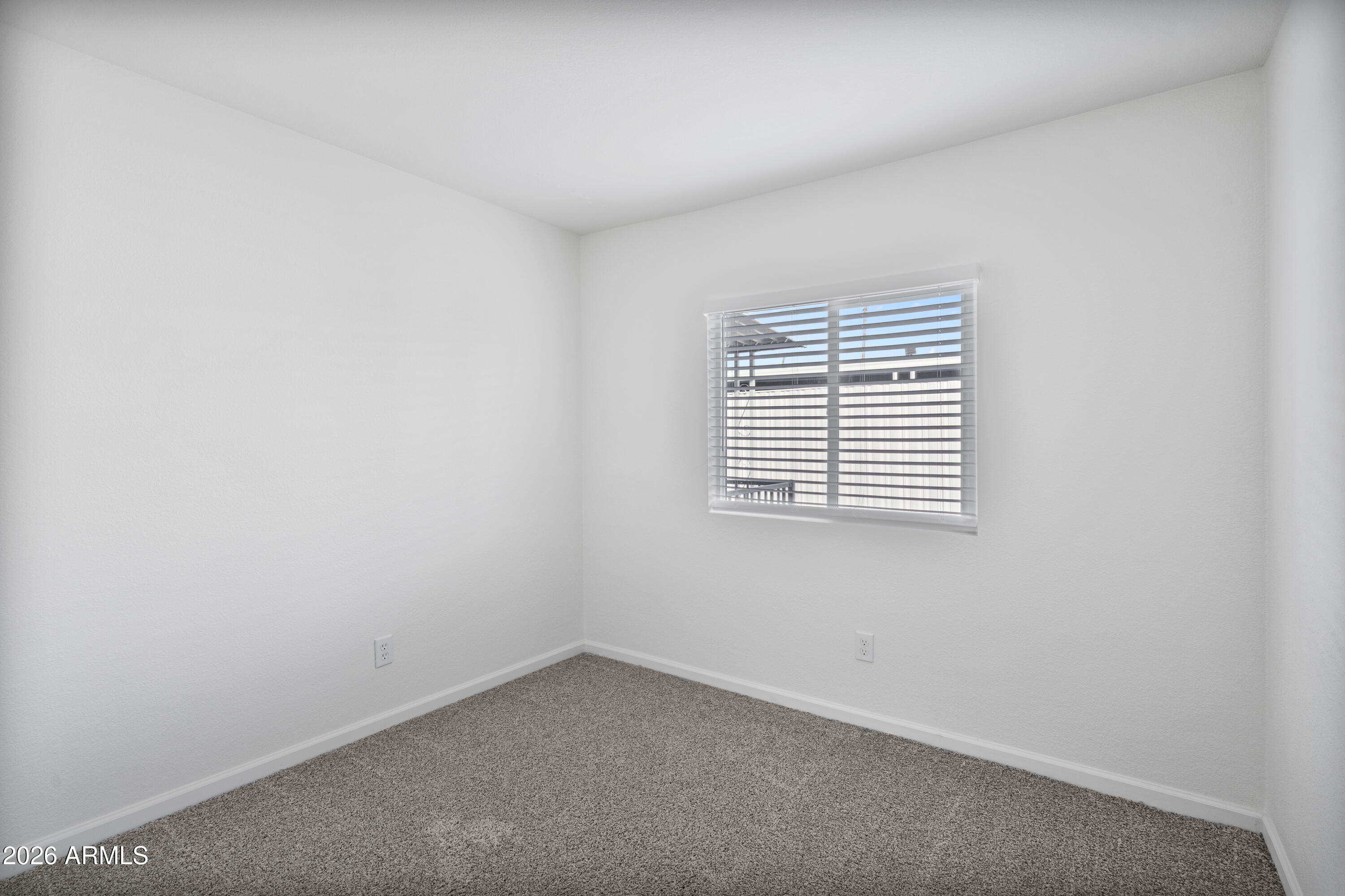 205 South Higley Road, Unit 52 Mesa, AZ 85206 - Photo 28 of 34 an empty room with a window