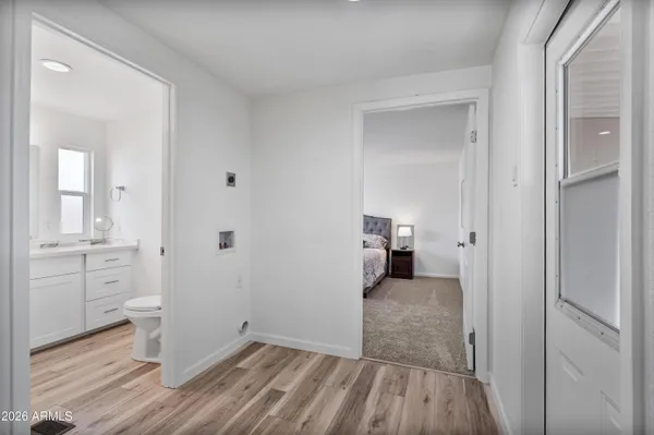 a view of a workspace with furniture and wooden floor