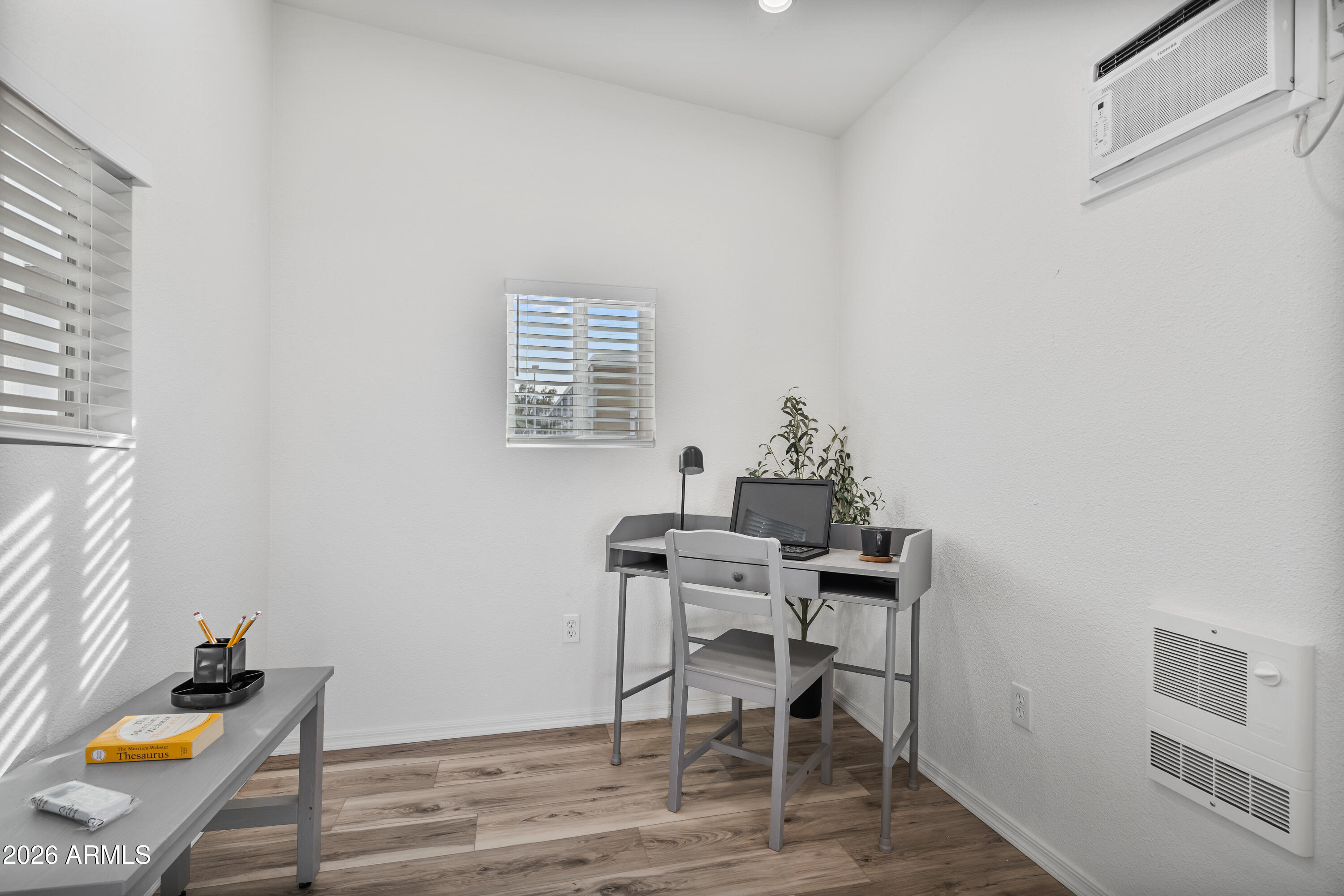 205 South Higley Road, Unit 52 Mesa, AZ 85206 - Photo 32 of 34 a view of a workspace with furniture and wooden floor