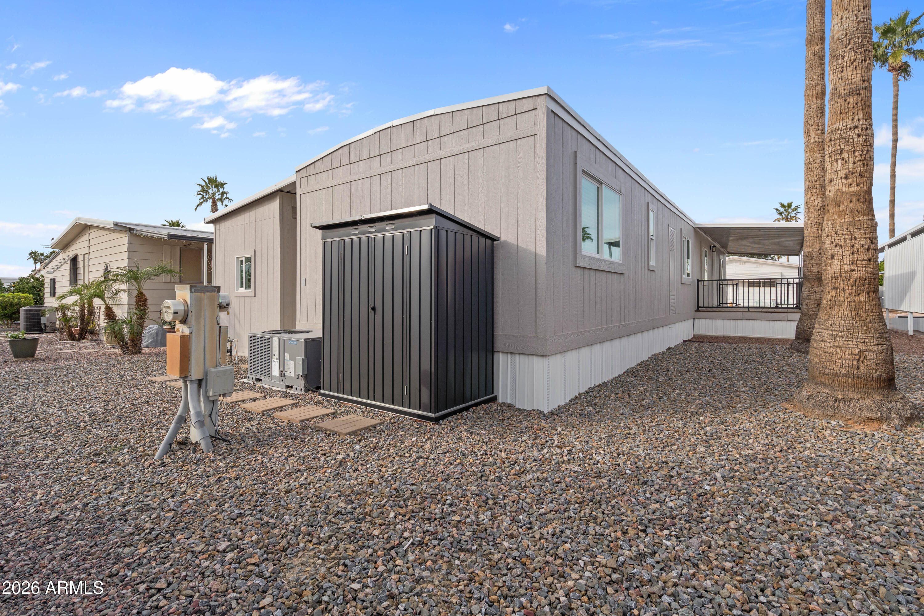 205 South Higley Road, Unit 52 Mesa, AZ 85206 - Photo 34 of 34 a front view of a house with a yard