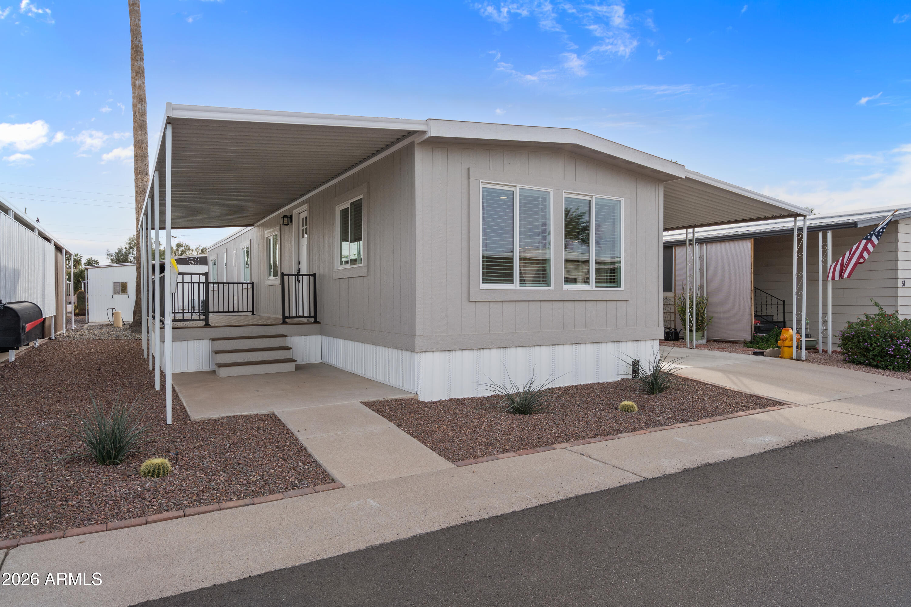 205 South Higley Road, Unit 52 Mesa, AZ 85206 - Photo 8 of 34 a front view of a house with a garage