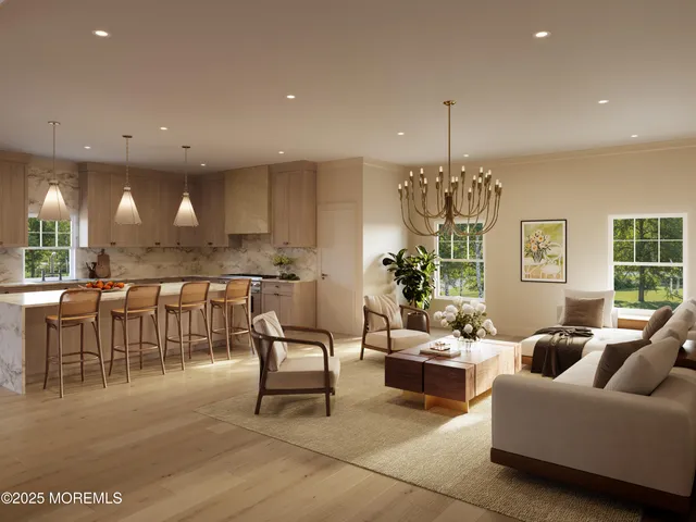 a living room with furniture and a chandelier