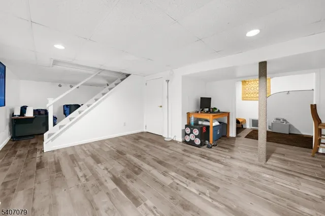 a room with furniture and wooden floor