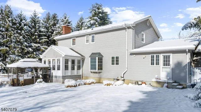 a front view of a house with a yard and glass windows