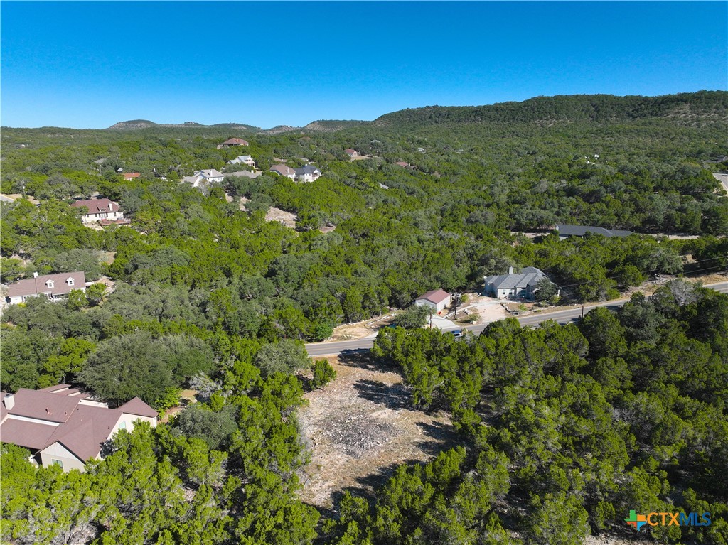 2114 Johnson Road Canyon Lake, TX 78133 - Photo 14 of 16 an aerial view of a house with mountain view