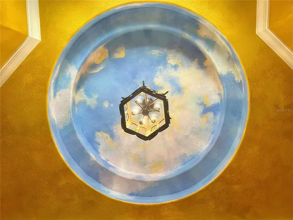 a view of a chairs and table in the patio