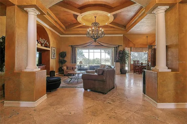 a kitchen with stainless steel appliances granite countertop a refrigerator and a stove