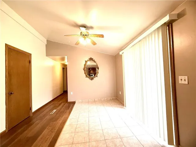 a view of a hallway with a bathroom