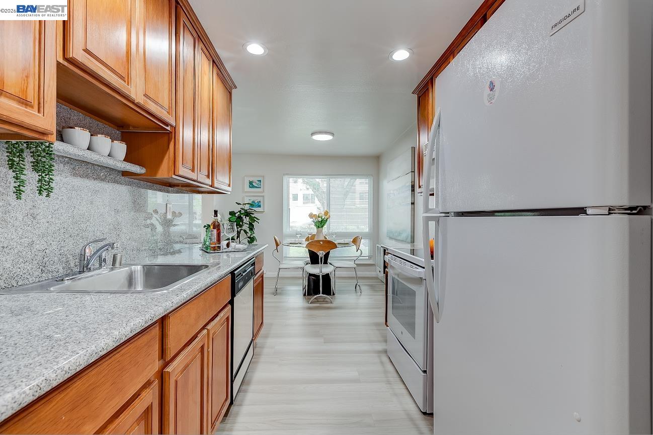 9005 Alcosta Boulevard, Unit 199 San Ramon, CA 94583 - Photo 31 of 57 a kitchen with a sink and refrigerator