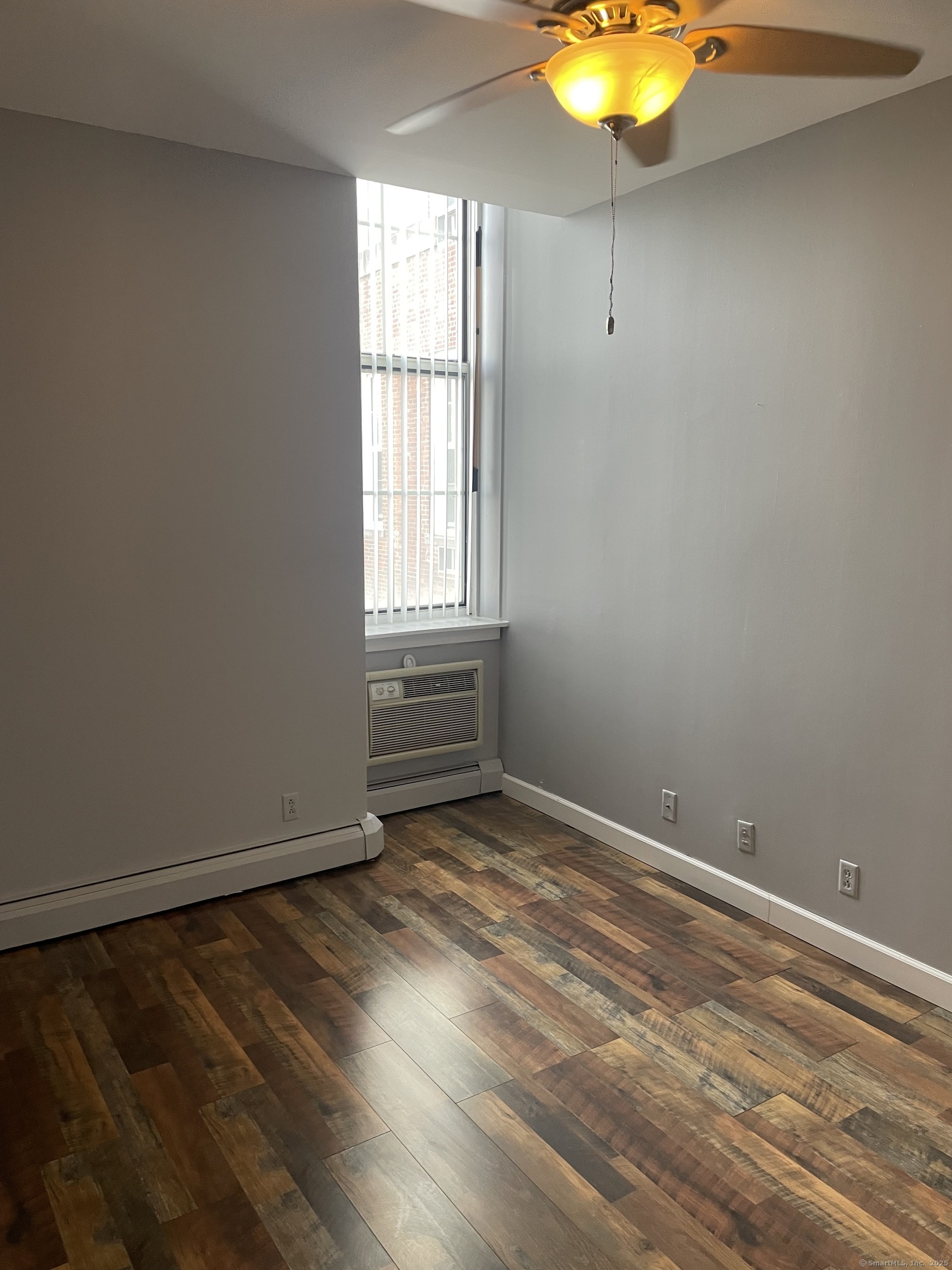124 Court Street, Unit 1103 New Haven, CT 06511 - Photo 12 of 21 wooden floor and window in an empty room