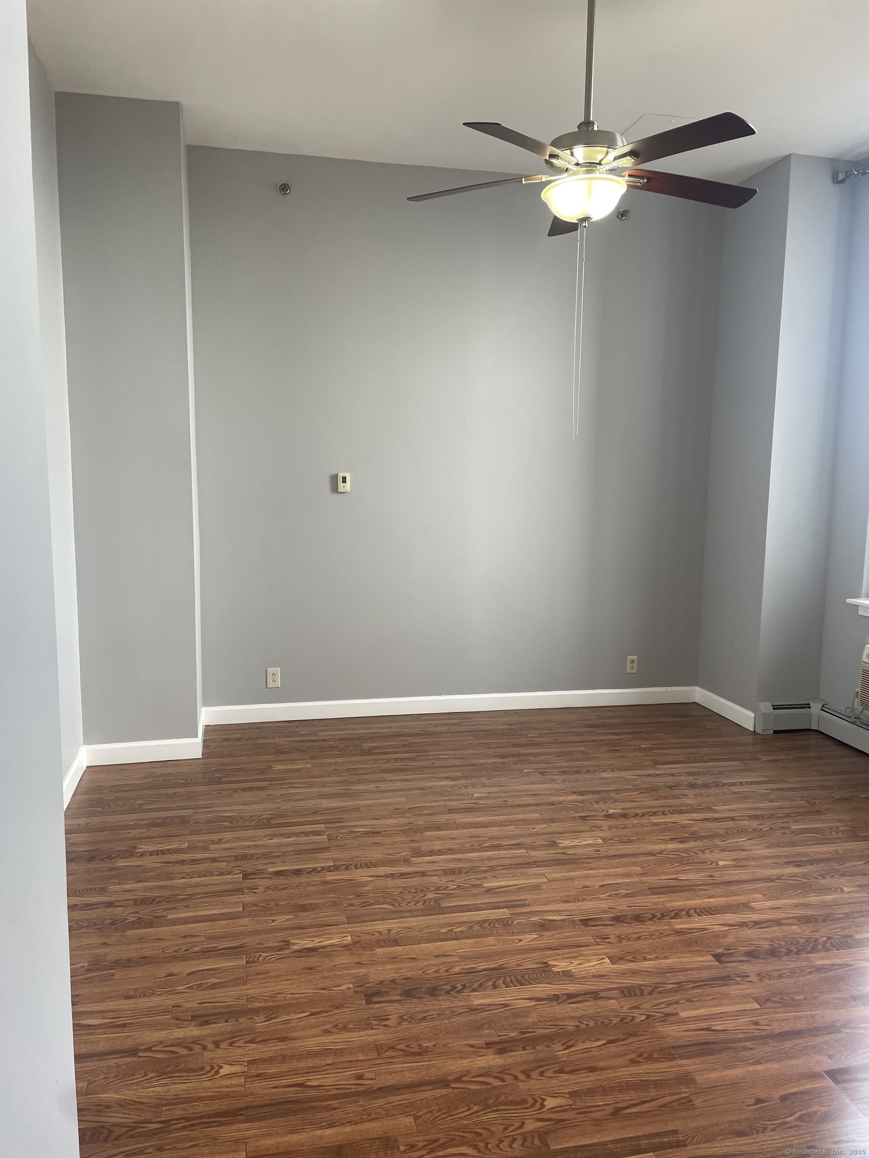 124 Court Street, Unit 1103 New Haven, CT 06511 - Photo 2 of 21 a view of empty room with wooden floor