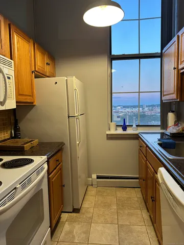 a kitchen with a refrigerator sink and stove
