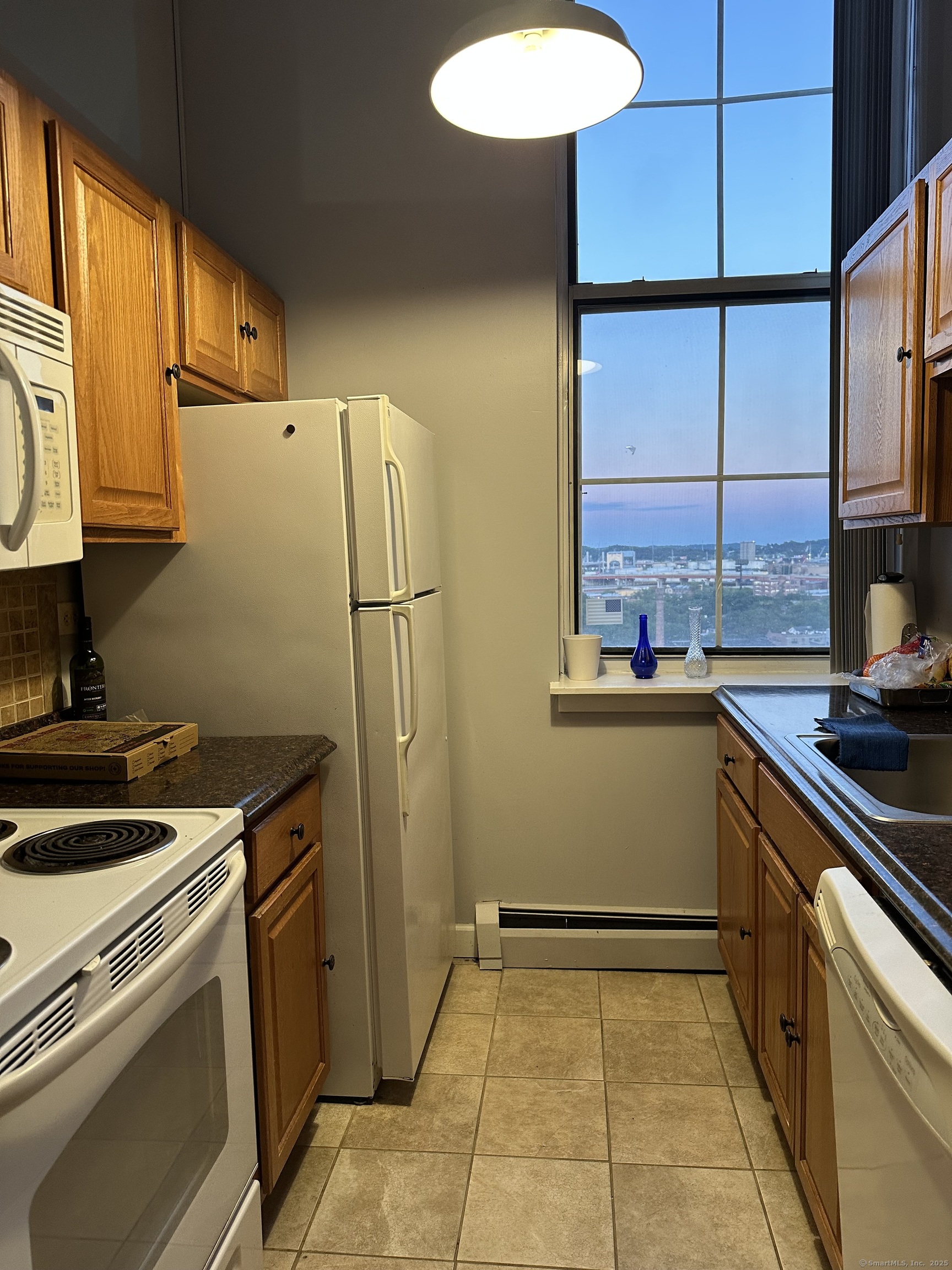124 Court Street, Unit 1103 New Haven, CT 06511 - Photo 5 of 21 a kitchen with a refrigerator sink and stove