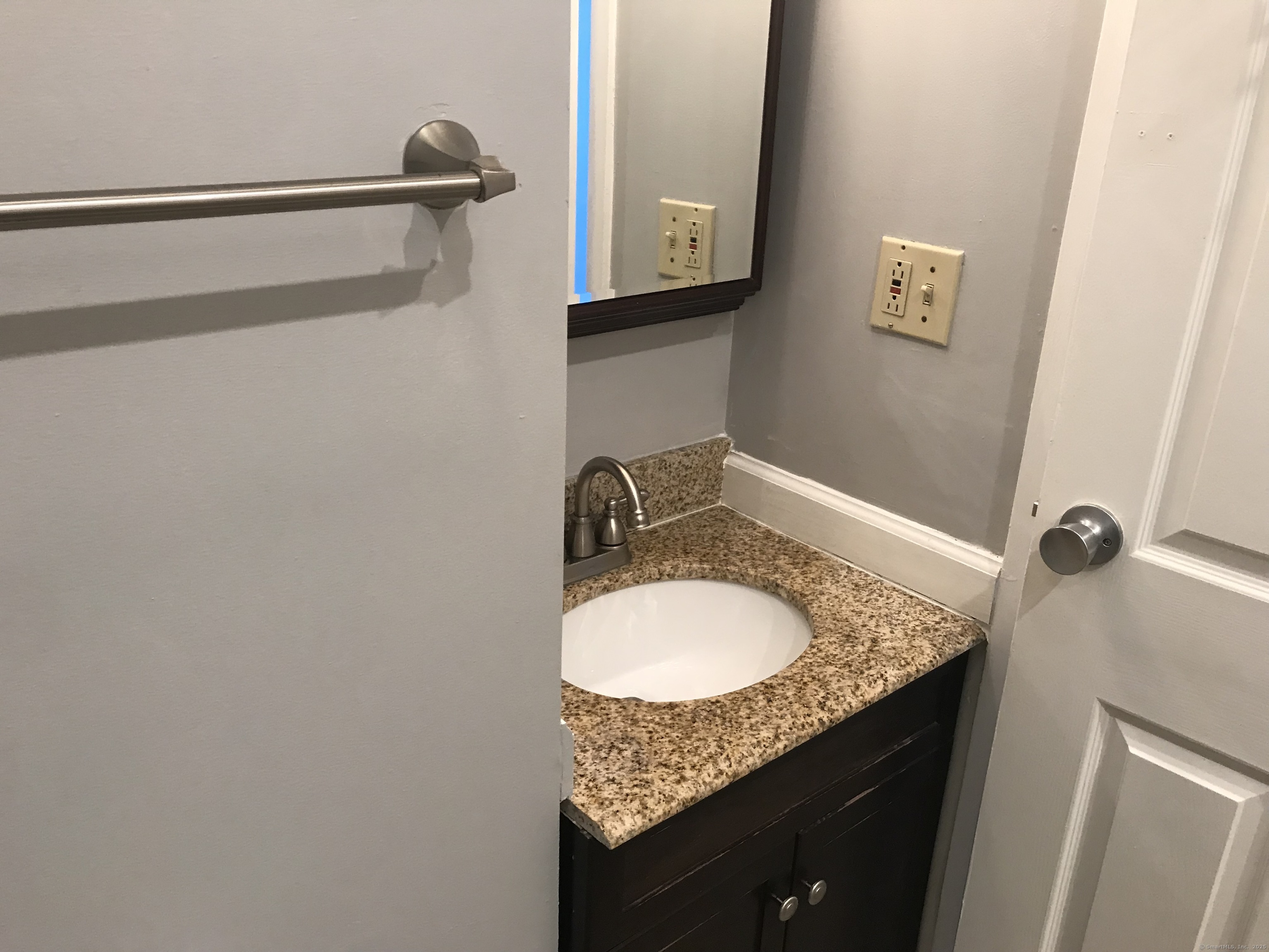 124 Court Street, Unit 1103 New Haven, CT 06511 - Photo 9 of 21 a bathroom with a granite countertop sink and a mirror