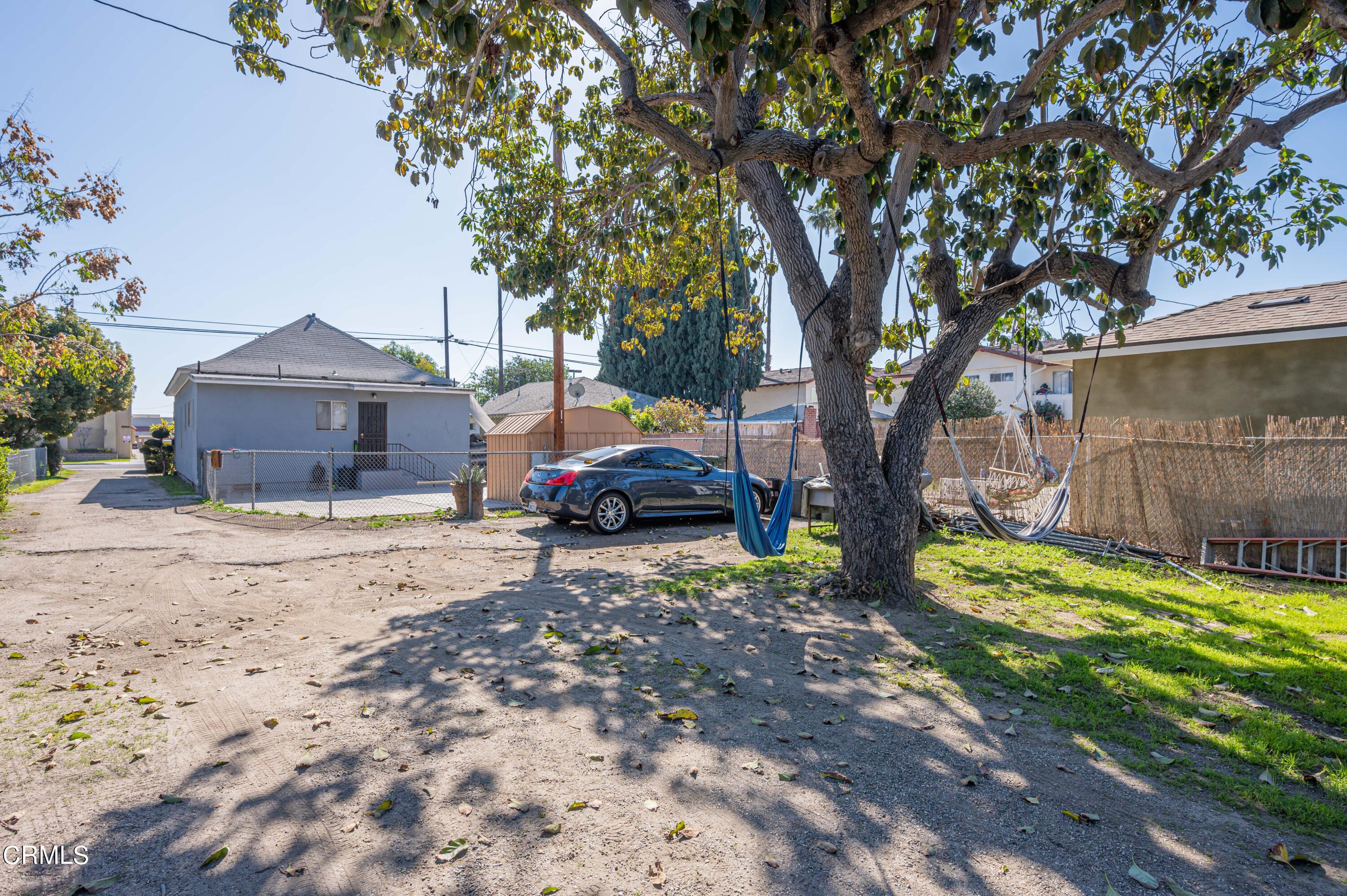 9911 Tweedy Lane Downey, CA 90240 - Photo 11 of 28 a house with a tree in front of it