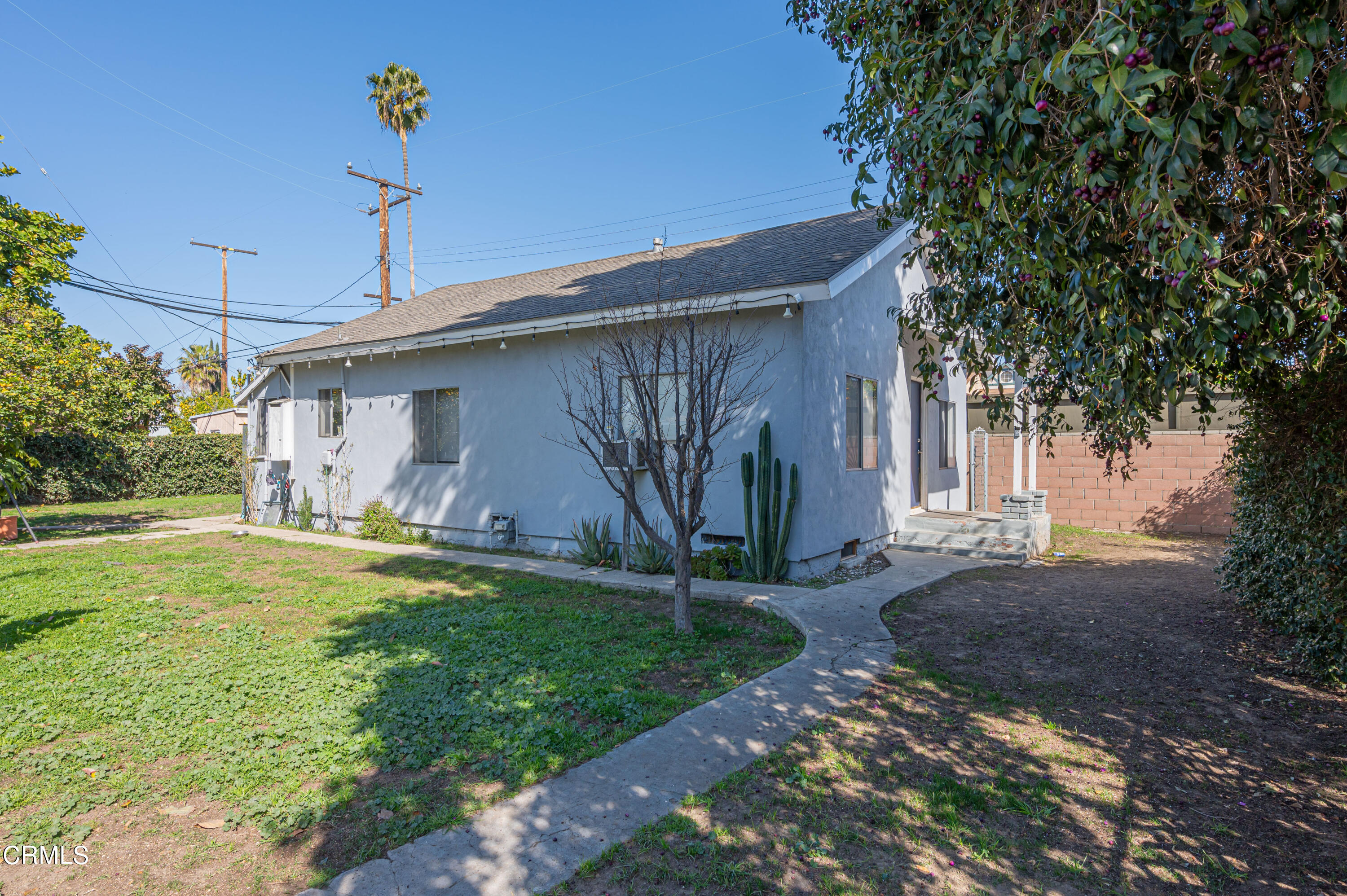 9911 Tweedy Lane Downey, CA 90240 - Photo 13 of 28 a front view of a house with garden