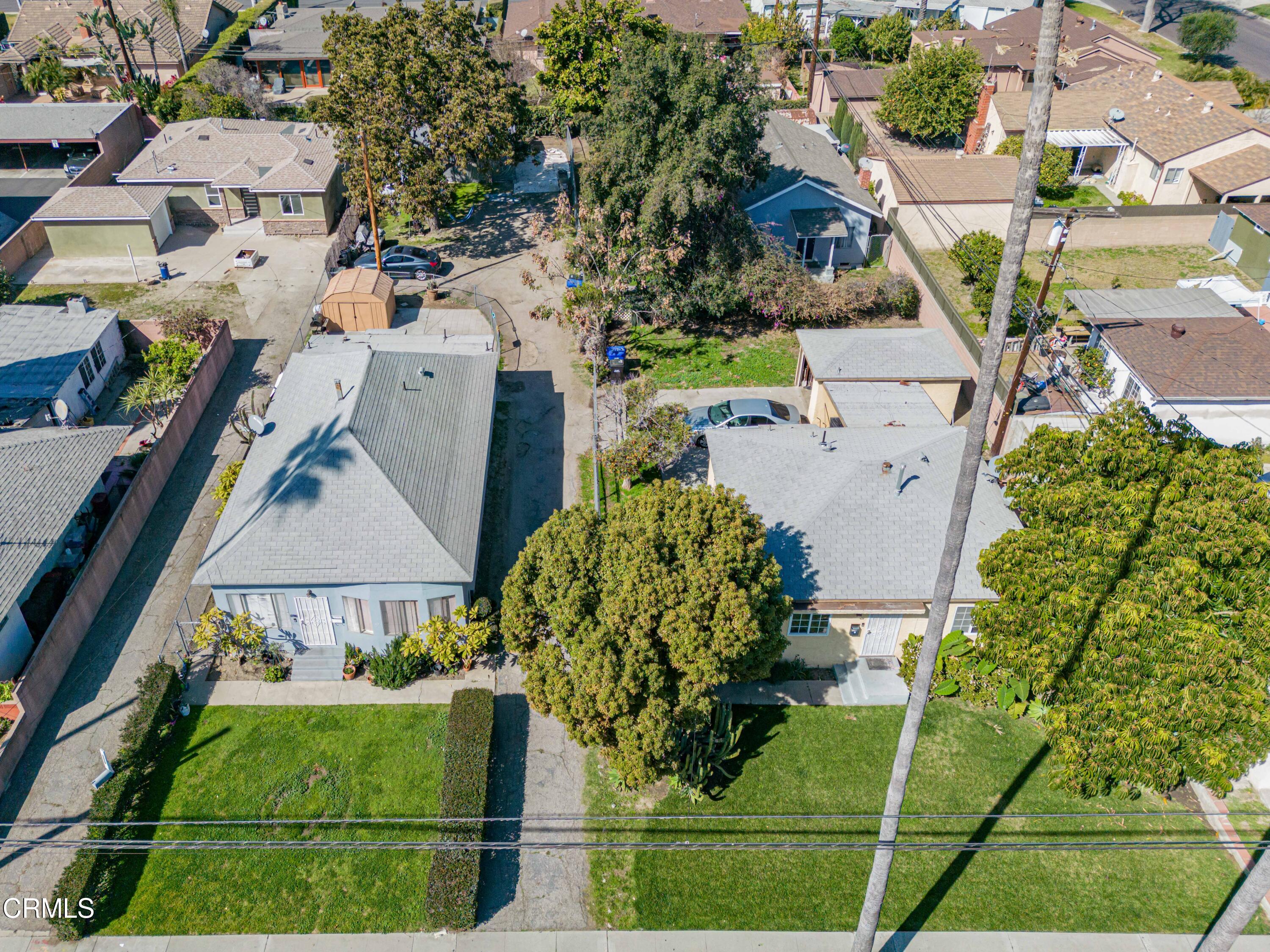 9911 Tweedy Lane Downey, CA 90240 - Photo 2 of 28 an aerial view of a house with a garden