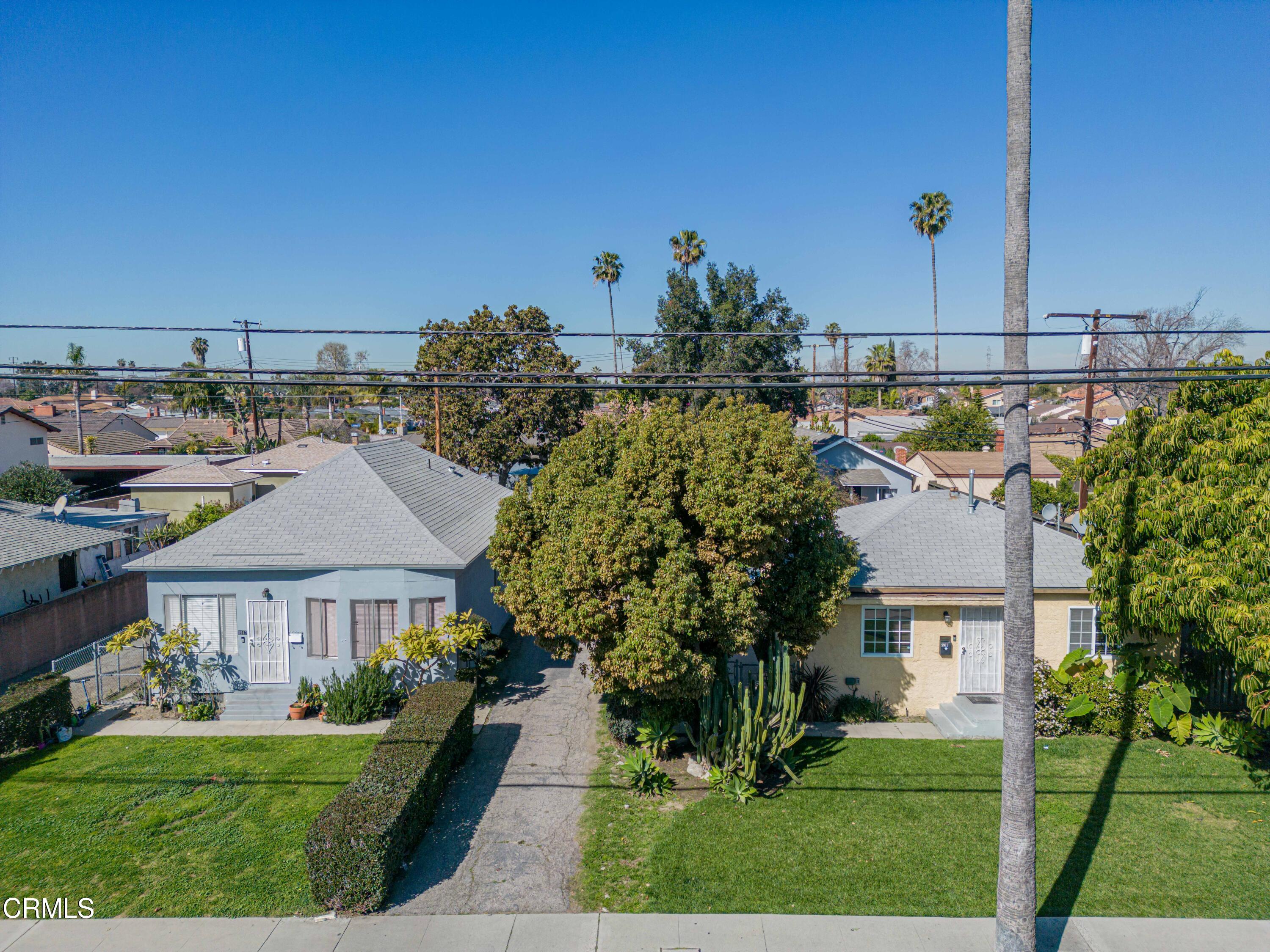 9911 Tweedy Lane Downey, CA 90240 - Photo 3 of 28 a aerial view of a house with a yard