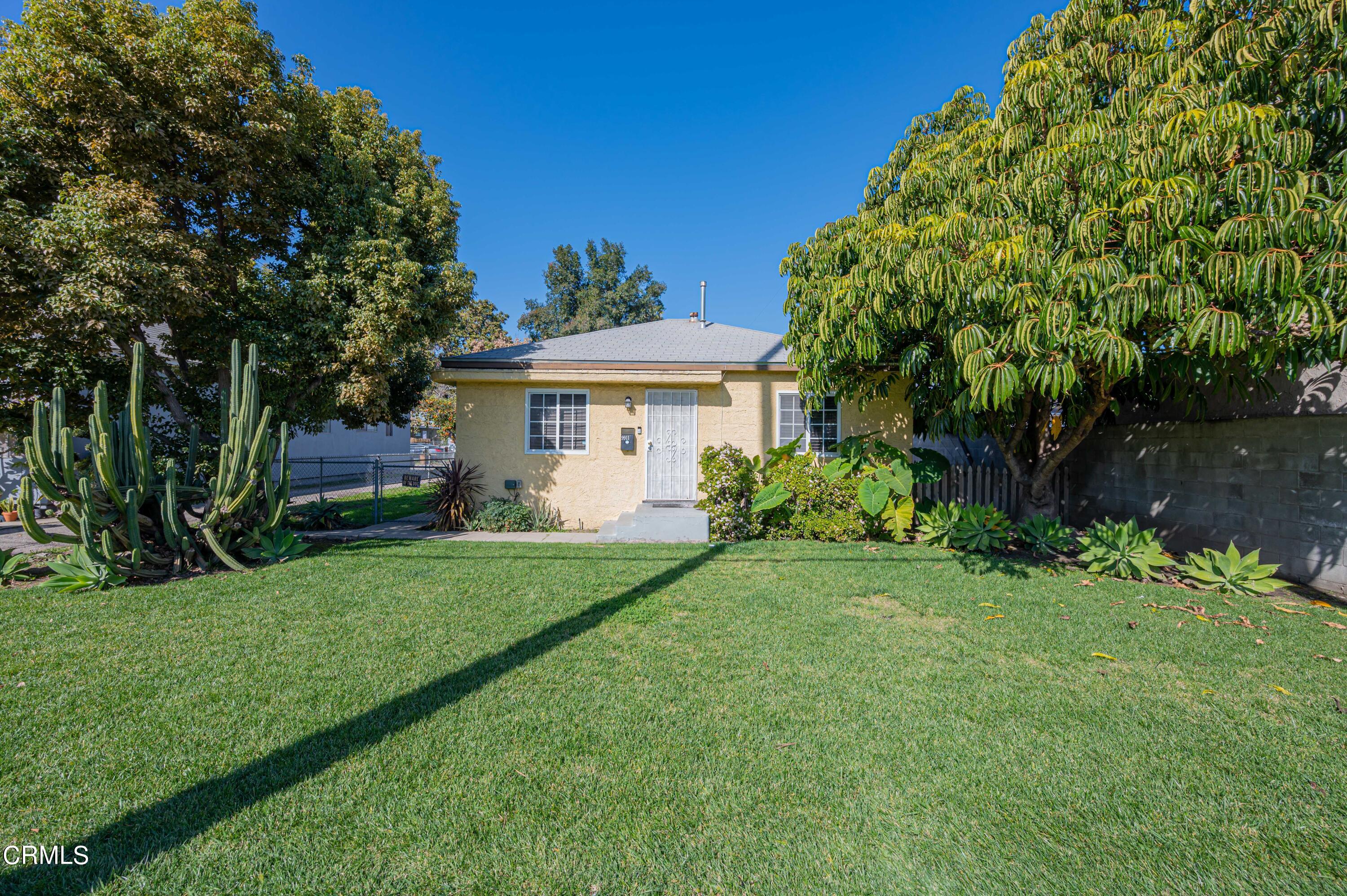 9911 Tweedy Lane Downey, CA 90240 - Photo 5 of 28 a view of a house with a yard