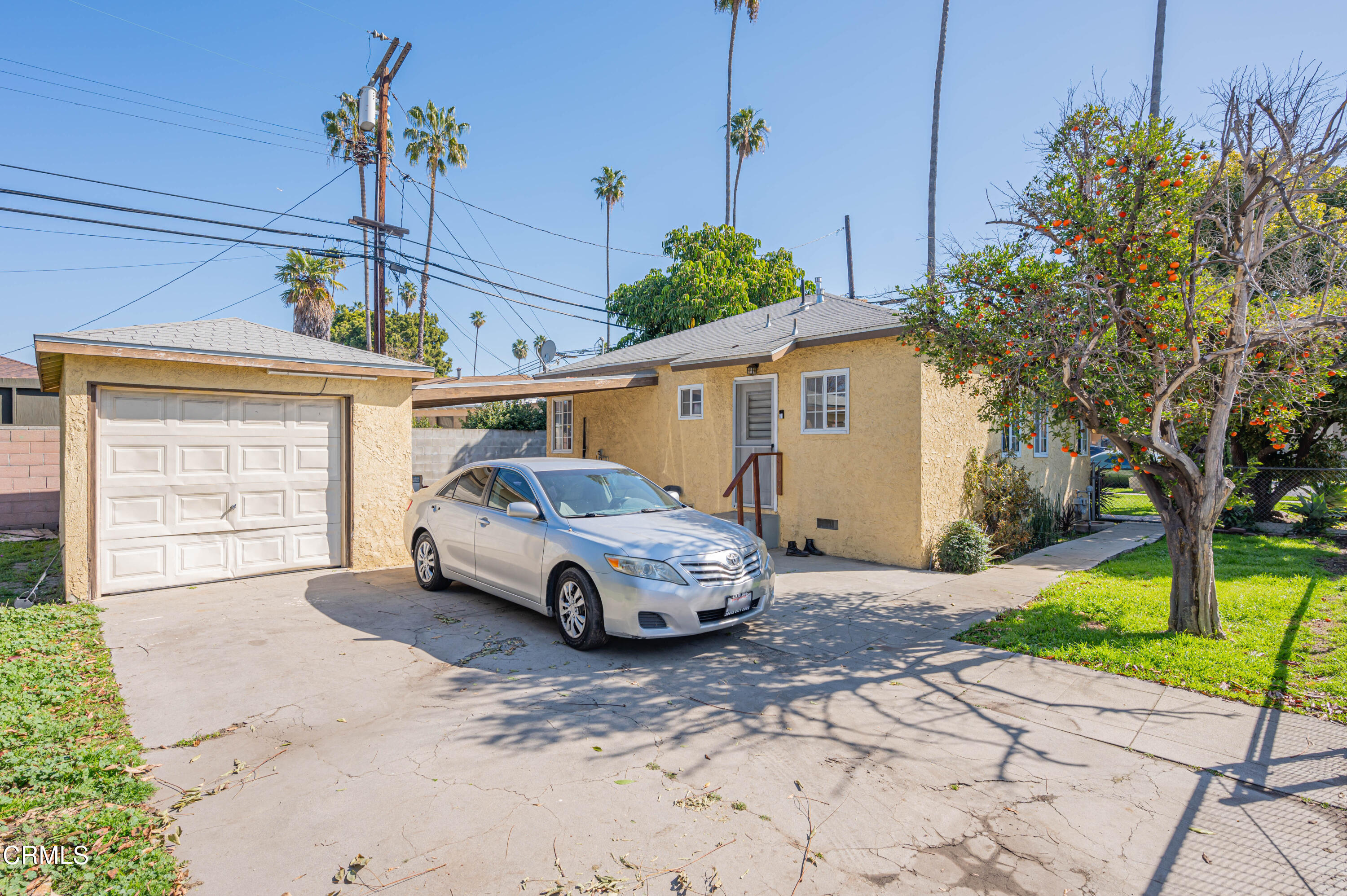 9911 Tweedy Lane Downey, CA 90240 - Photo 8 of 28 a car parked in front of a house
