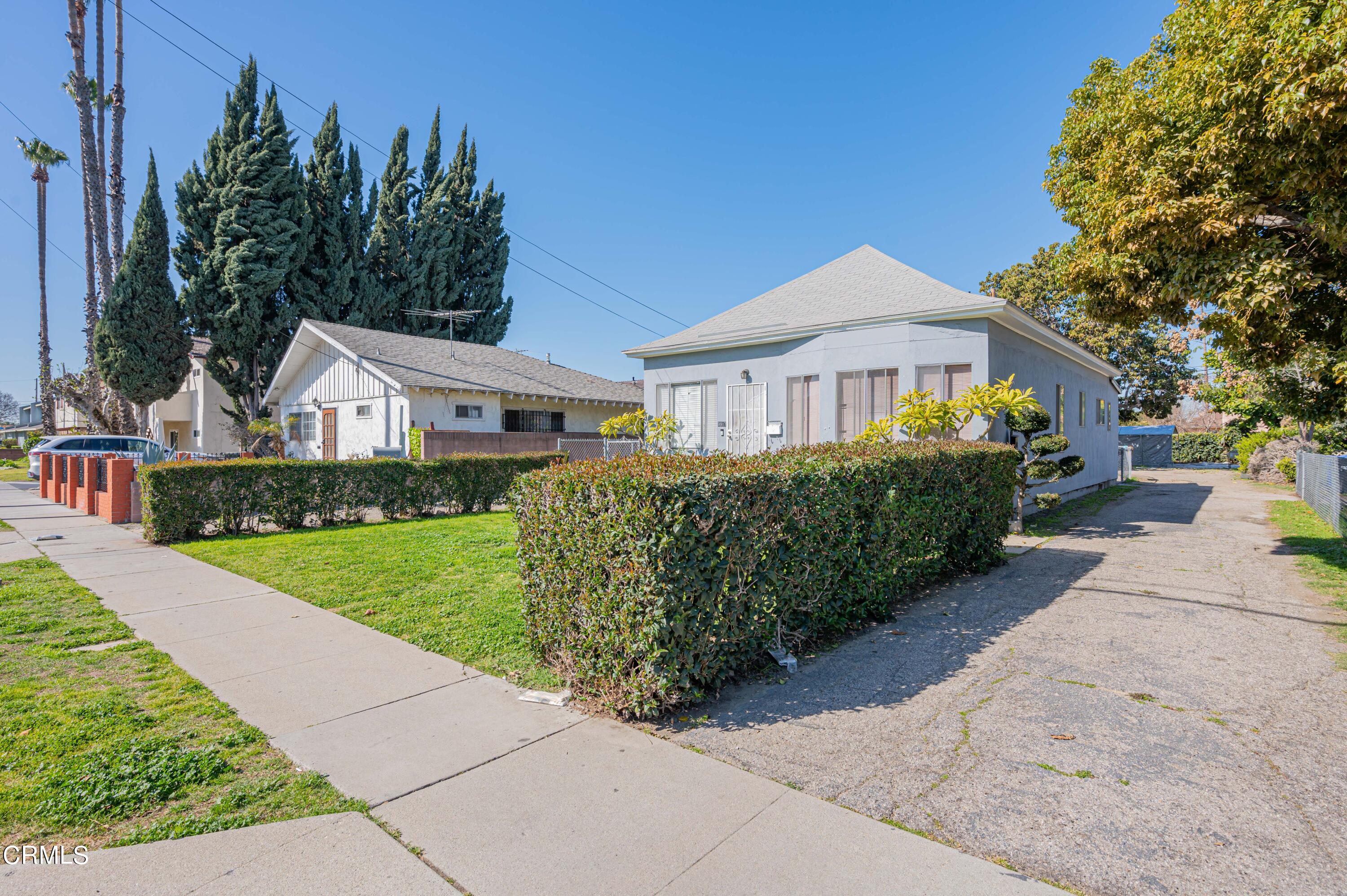 9911 Tweedy Lane Downey, CA 90240 - Photo 10 of 28 a front view of a house with garden