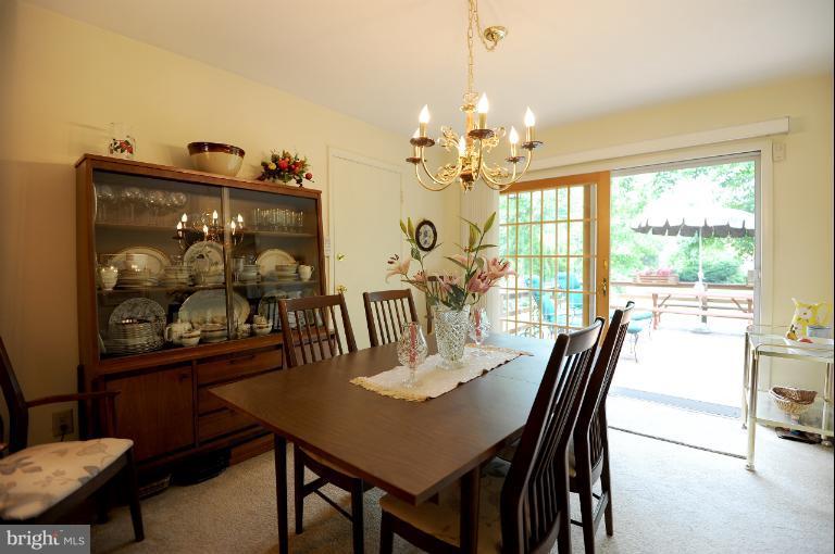 6505 Divine Street McLean, VA 22101 - Photo 12 of 26 a view of a dining room with furniture window and outside view