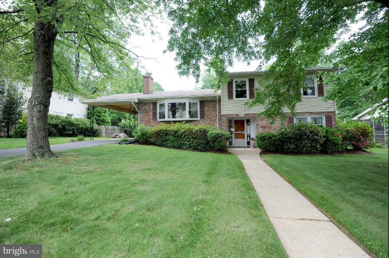 6505 Divine Street McLean, VA 22101 - Photo 18 of 26 a front view of a house with a yard