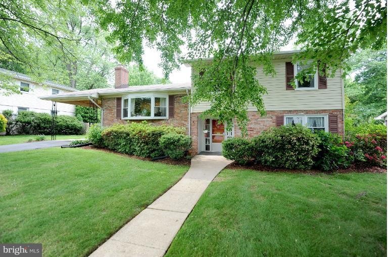 6505 Divine Street McLean, VA 22101 - Photo 19 of 26 a front view of house with yard and green space