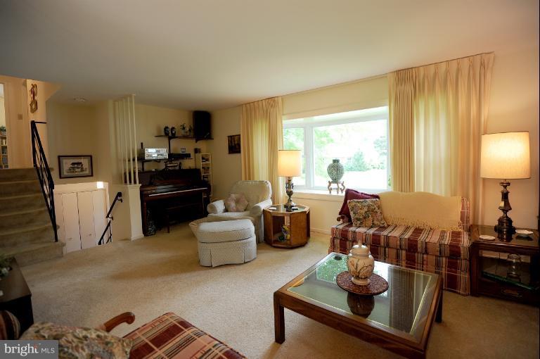 6505 Divine Street McLean, VA 22101 - Photo 3 of 26 a living room with furniture and a flat screen tv