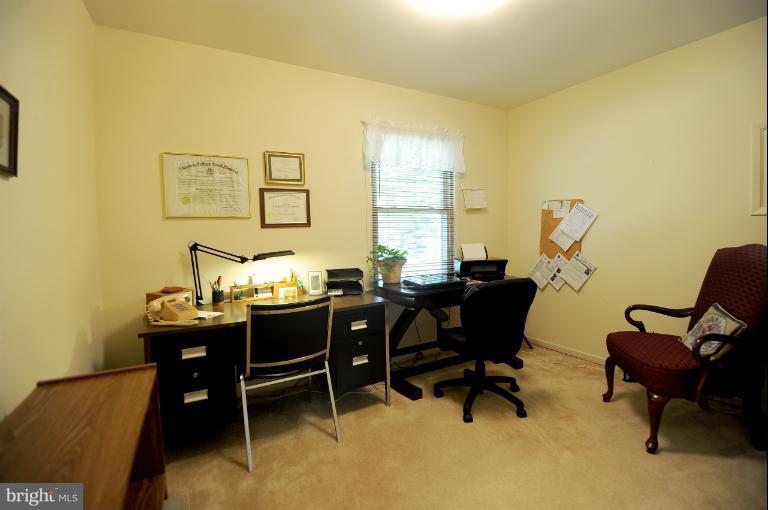 6505 Divine Street McLean, VA 22101 - Photo 9 of 26 a view of a dining room with furniture and a window